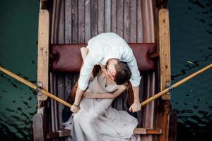 A boat trip for a guy and a girl along the canals and bays of the river photo