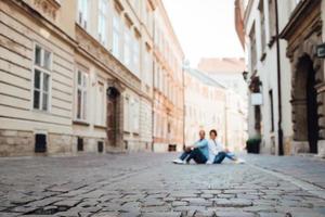 Guy and a girl happily walk in the morning on the empty streets photo