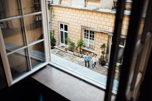 Guy and a girl happily walk in the morning on the empty streets photo