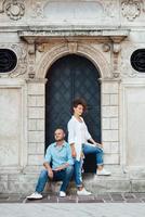 Guy and a girl happily walk in the morning on the empty streets photo