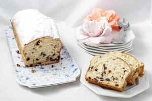 Sliced plum cake on a dish photo