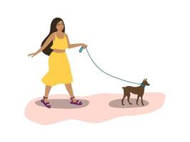 A young woman walks the dog