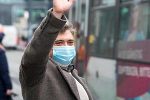 Wearing protective masks outdoors in the downtown photo