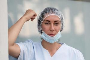 Woman doctor during a work break photo