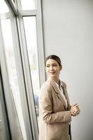 Woman standing in modern office photo