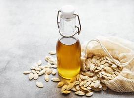 Bottle with pumpkin seed oil photo