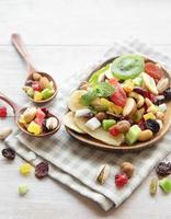 Bowls with various dried fruits and nuts photo