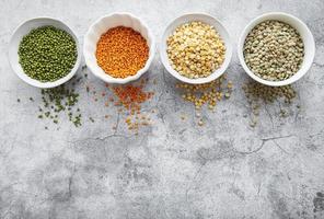 Bowls with different types of legumes photo