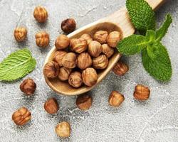 Peeled hazelnuts in spoon photo