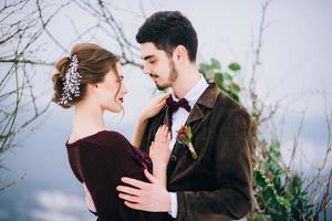 walk the groom and the bride in the Carpathian mountains photo