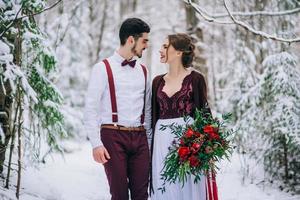 walk the groom and the bride in the Carpathian mountains photo