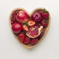 Fresh fruits in a heart-shaped bowl photo