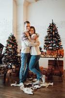 guy and a girl celebrate the new year together and give each other gifts photo