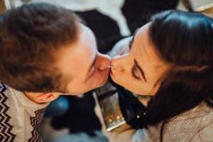 guy and a girl celebrate the new year together and give each other gifts photo