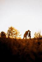 Cheerful guy and girl on a walk in bright knitted hats photo