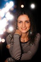 girl lit sparklers inside a wooden house photo