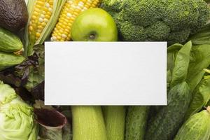 Blank card on vegetables photo