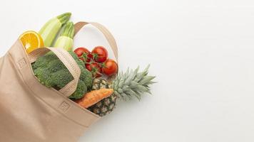 Tote of fresh vegetables and fruit photo