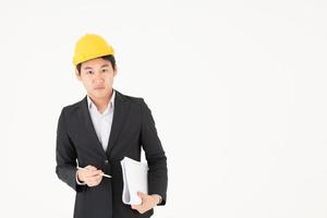 Ingeniero de construcción masculino asiático seguimiento del progreso de la construcción foto