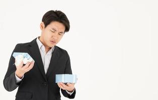 Asian businessman and expressions when opening gift boxes