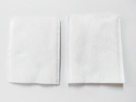 stack of white cotton pads on white background photo