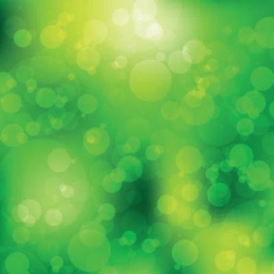 Multicolored blurry bokeh on a green background