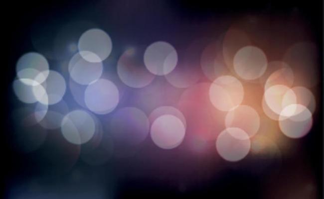 Multicolored blurry bokeh on a dark background