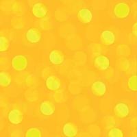 Yellow abstract blurred background with bokeh effect vector