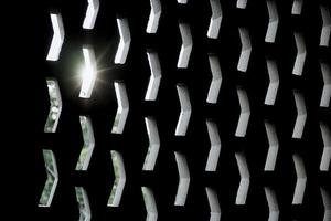 Abstract pattern of a concrete wall with rays of light on a sunset background. Backdrop and wallpaper of cement structure photo