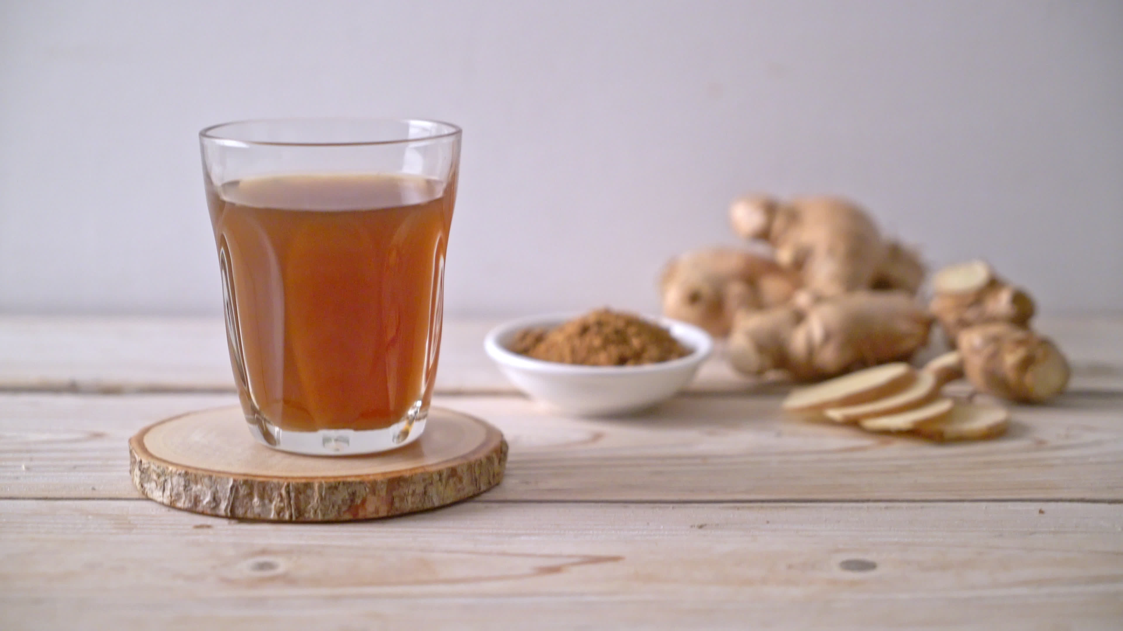 Hot and Sweet Ginger Juice with Ginger Roots 2382725 Stock Video at