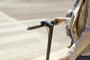 Close-up of a woman on an electric scooter photo