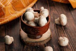 Mushrooms in a wooden bowl photo