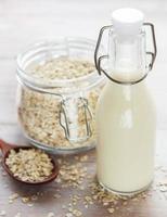 Vegan non-dairy alternative milk. Oat flakes milk