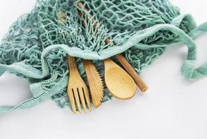 Mesh bag and bamboo cutlery photo