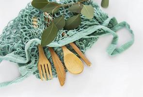 Mesh bag and bamboo cutlery photo