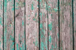 Old wooden planks with green paint photo