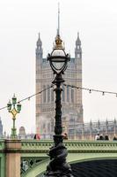 Dolphin lamp standard on Thames Embankment in London at the Westminster Bridge photo