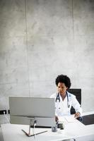 Doctor working in an office with copy space photo
