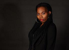 Woman dressed in black on a black background photo