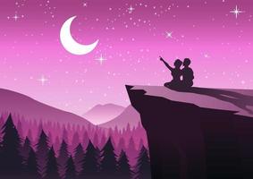 couple pointing to the moon in a night with stars sitting on cliff and close to a pine forest