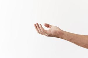 Side view of hand asking for food donations on white background photo