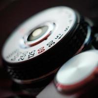 Close up image of a film camera shutter dial