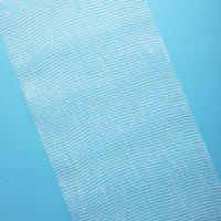 Sterile bandage on blue background photo
