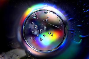 Abstract circle with spectral colors and bubbles photo