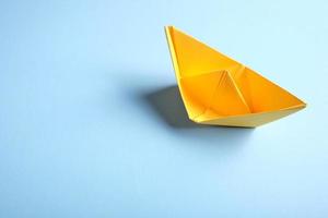 Origamo boats on blue background photo