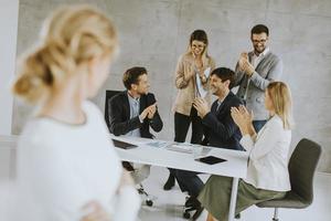 Woman looking at her coworkers photo