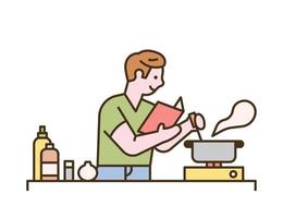 un hombre está cocinando mientras mira un libro de recetas vector