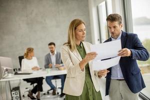 Professionals discussing document photo