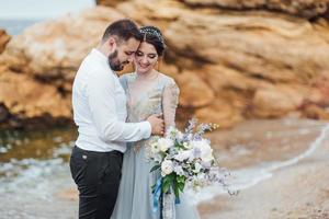 Same couple with a bride in a blue dress walk photo