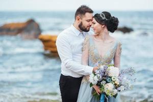 Same couple with a bride in a blue dress walk photo